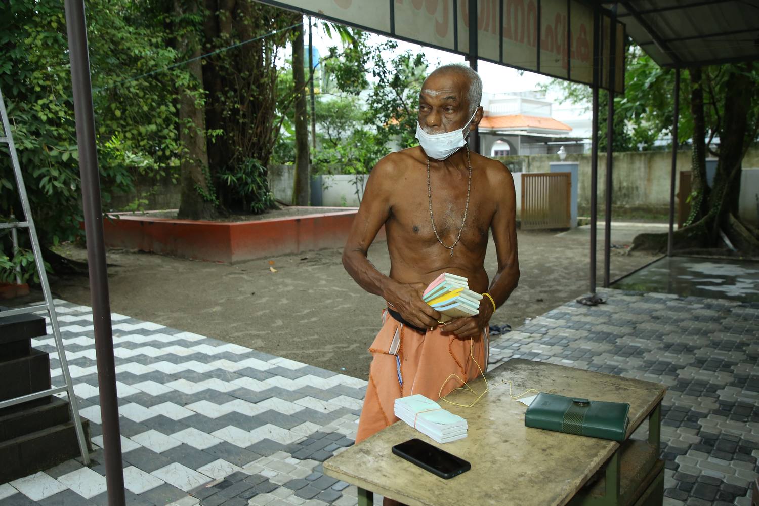 Temple priest preparing prasadam