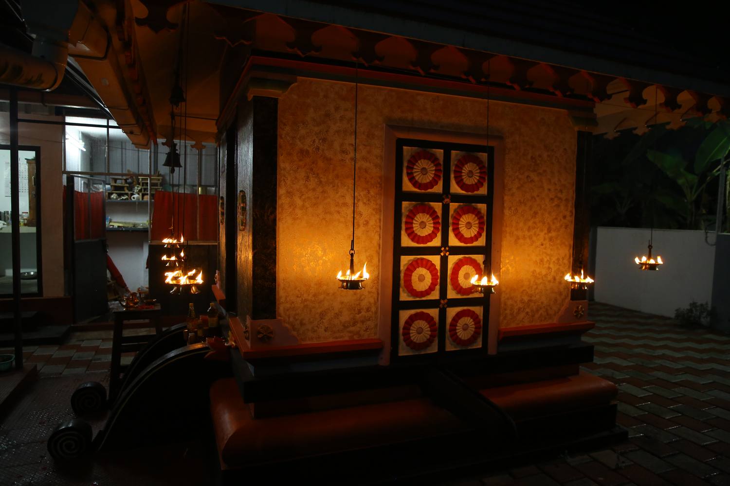 Sanctum doorway lit with hanging oil lamps